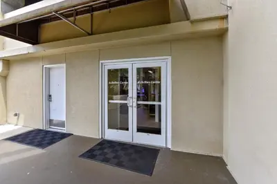 a glass door on a building with at Emerald Beach #636 by Book That Condo in Panama City Beach
