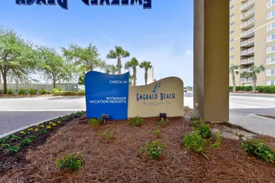 a sign for the grand island beach resort at Emerald Beach #636 by Book That Condo in Panama City Beach