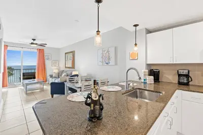 a kitchen with a sink and a counter top at Grand Panama Beach Resort #406-1 by Book That Condo in Panama City Beach