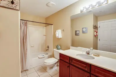 a bathroom with a sink and a toilet and a shower at Ocean Villa Condos #801 by Book That Condo in Panama City Beach