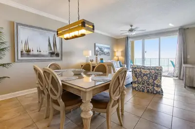 a dining room with a table and chairs at Twin Palms Resort #404 by Book That Condo in Panama City Beach