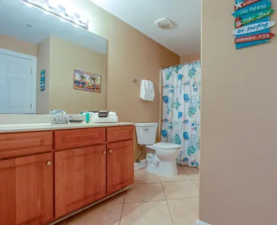 a bathroom with a sink and a toilet and a shower at Twin Palms Resort #601 by Book That Condo in Panama City Beach