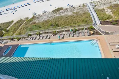 an overhead view of a swimming pool next to the beach at Twin Palms Resort #601 by Book That Condo in Panama City Beach