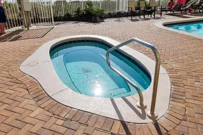 a small swimming pool with a hand rail next to it at Twin Palms Resort #1605 by Book That Condo in Panama City Beach