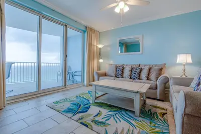 a living room with a couch and a table at Twin Palms Resort #1605 by Book That Condo in Panama City Beach
