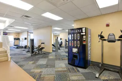 a gym with a vending machine in a room at Tidewater Beach Resort #508 by Book That Condo in Panama City Beach