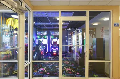 a store front with glass doors with a lot of games at Tidewater Beach Resort #508 by Book That Condo in Panama City Beach