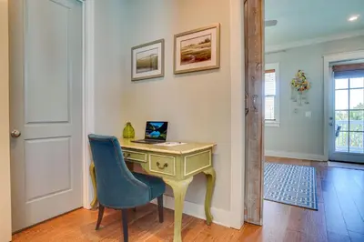 a home office with a desk and a blue chair at 30A Blue Crab Cottage by Panhandle Getaways in Rosemary Beach