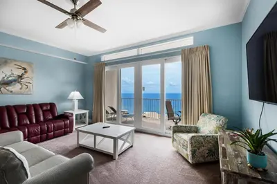 a living room with a couch and chairs and a television at Laketown Wharf 2118 in Panama City Beach