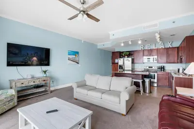 a living room with a couch and a table at Laketown Wharf 2118 in Panama City Beach