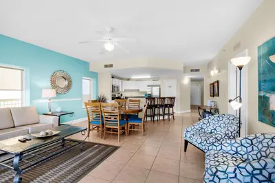 a living room with a couch and a table at Calypso 1-1809 East in Panama City Beach