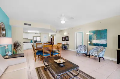 a living room with a couch and a table at Calypso 1-1809 East in Panama City Beach