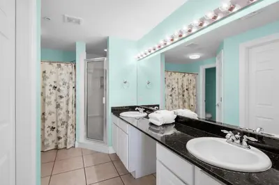 a bathroom with a sink and a mirror at Calypso 1-1809 East in Panama City Beach