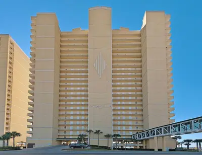 a large building with a clock on the front of it at Ocean Villa 405 in Panama City Beach