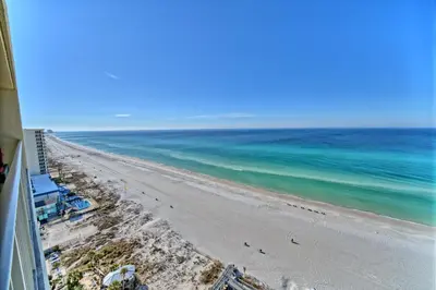 a view of the beach from the balcony of a condo at Cozy Oceanfront Condo with Beachside Pool - Unit 1602 in Panama City Beach