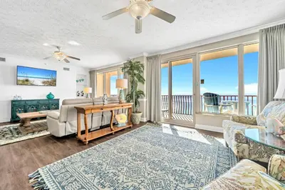 a living room with a view of the ocean at Hidden Dunes 1401 in Panama City Beach