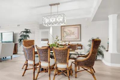 a dining room with a table and chairs at Hidden Dunes 304 in Panama City Beach