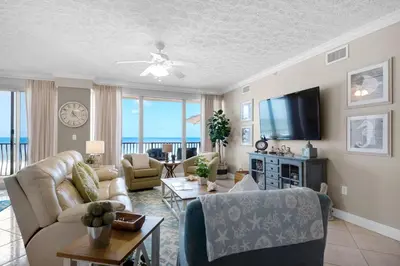 a living room with a view of the ocean at Hidden Dunes 402 in Panama City Beach