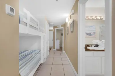 a hallway of a bathroom with a sink at Calypso 1-203 East in Panama City Beach