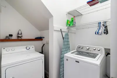 a laundry room with a washer and dryer at Pure Joy* in Santa Rosa Beach