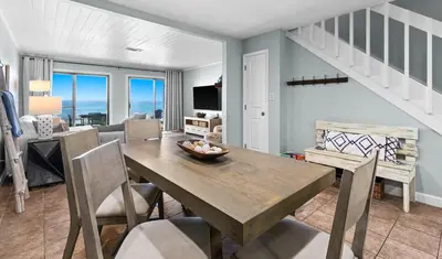 a dining room with a table and chairs at Silver Sands Townhomes Unit 4 in Inlet Beach