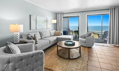 a living room with a couch and chairs and a table at Silver Sands Townhomes Unit 4 in Inlet Beach
