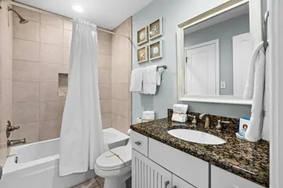 a bathroom with a sink and a toilet and a shower at Silver Sands Townhomes Unit 4 in Inlet Beach