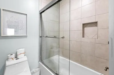 a bathroom with a shower with a glass door at Silver Sands Townhomes Unit 4 in Inlet Beach