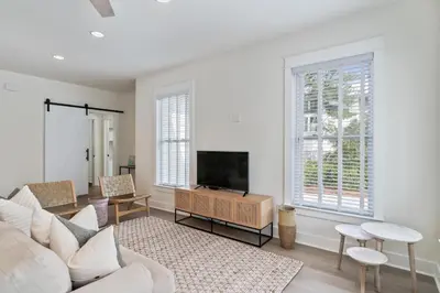 a living room with a couch and a tv at 248 Beach Bike Way in Inlet Beach