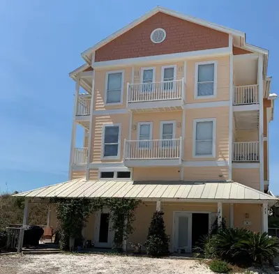 a large building with balconies on top of it at Chivas Apartment on 30A in Santa Rosa Beach