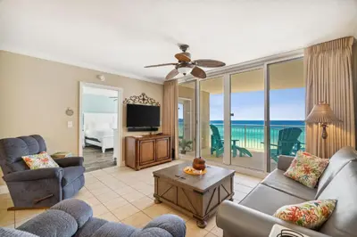 a living room with a view of the ocean at Flipflop Paradise Unit 625 in Panama City Beach