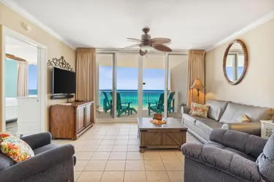 a living room with a couch and a tv at Flipflop Paradise Unit 625 in Panama City Beach