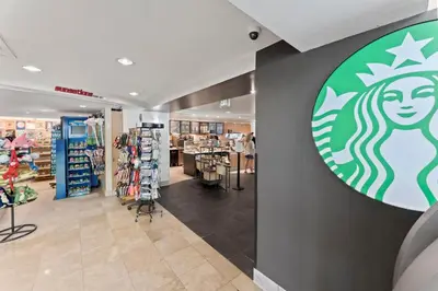 a store with a starbucks sign on the wall at Flipflop Paradise Unit 625 in Panama City Beach