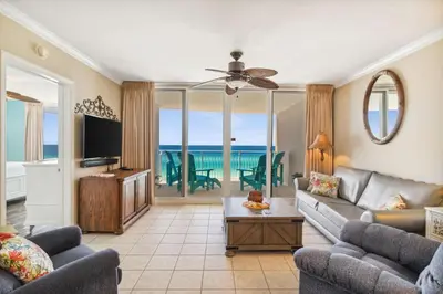 a living room with a couch and a tv at Flipflop Paradise Unit 625 in Panama City Beach