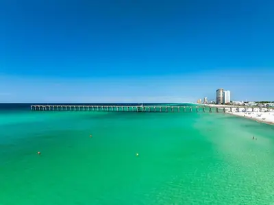 an aerial view of a beach with a pier at Endless Summer's 514 in Panama City Beach