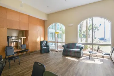 a living room with a couch and chairs at Celadon Beach Resort #1104 by Book That Condo in Panama City Beach