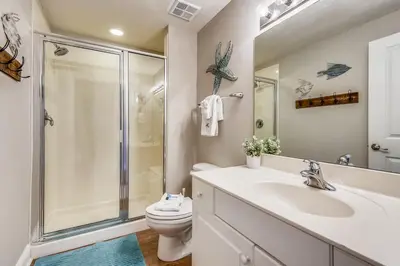 a bathroom with a sink and a shower and a toilet at Celadon Beach Resort #1104 by Book That Condo in Panama City Beach