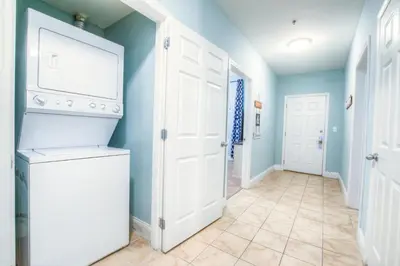 a laundry room with a washer and dryer at Large 3 Bd Penthouse 2034 In Laketown, Great Views and Amenities! in Panama City Beach