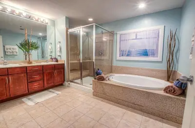 a large bathroom with a tub and a shower at BEAUTIFUL 3 BD Laketown Wharf 1133- Best Amenities! in Panama City Beach