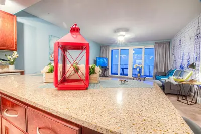 a kitchen with a red object on a counter at BEAUTIFUL 3 BD Laketown Wharf 1133- Best Amenities! in Panama City Beach