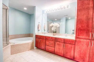 a bathroom with a tub and a sink and a bath tub at Laketown Wharf 1238 - Brand New End Unit With Wrap Around Balcony in Panama City Beach