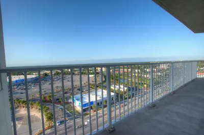 a balcony with a view of a parking lot at Laketown Wharf 1238 - Brand New End Unit With Wrap Around Balcony in Panama City Beach