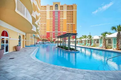 a swimming pool at a resort with a hotel at Calypso 3-205 in Panama City Beach