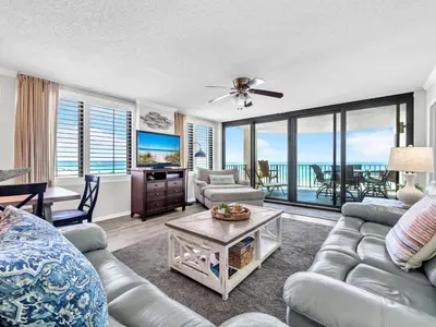 a living room with a couch and a table at Watercrest 402 in Panama City Beach