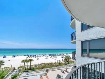a view of the beach from the balcony of a building at Watercrest 402 in Panama City Beach