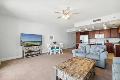 a living room with a couch and a table at Spacious Resort Condo with Breathtaking Gulf Views! by Dolce Vita Getaways PCB in Panama City Beach