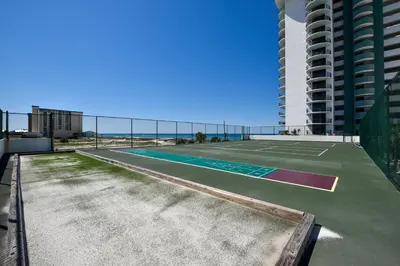 a tennis court on the side of a building at Watercrest #1206 by Book That Condo in Panama City Beach
