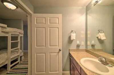 a bathroom with a sink and a mirror at 18th-Floor PCB Resort Condo with Amazing Gulf View! in Panama City Beach