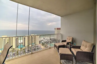 a balcony with chairs and a view of the ocean at 18th-Floor PCB Resort Condo with Amazing Gulf View! in Panama City Beach