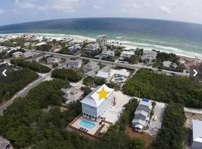 an aerial view of a building with a yellow star on it at Sea It All in Santa Rosa Beach